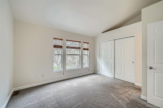 3033 W 107th Pl Unit D, Westminster, CO 80031 - unfurnished bedroom with baseboards, carpet flooring, lofted ceiling, and visible vents