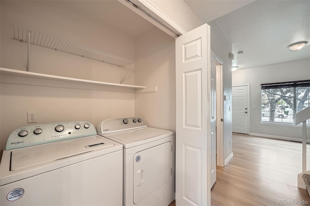 3033 W 107th Pl Unit D, Westminster, CO 80031 - laundry area featuring separate washer and dryer, baseboards, laundry area, and light wood-type flooring