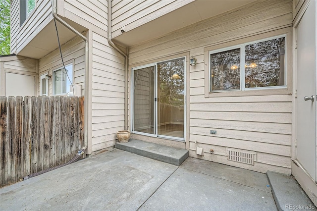 3033 W 107th Pl Unit D, Westminster, CO 80031 - view of exterior entry featuring a patio area and fence
