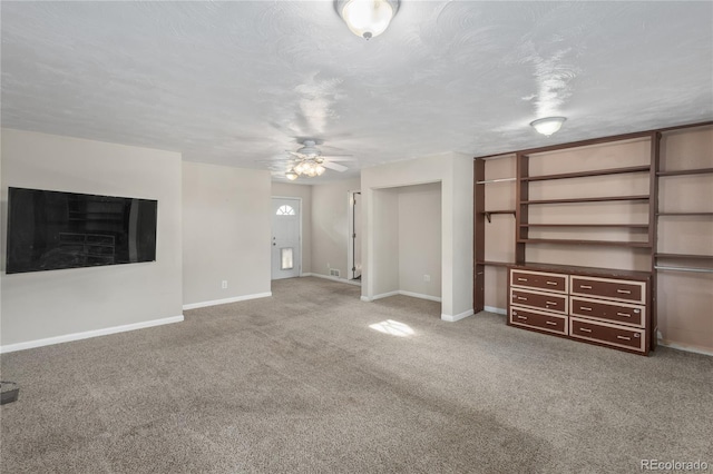 6077 Flower St, Arvada, CO 80004 - unfurnished living room with carpet and a ceiling fan