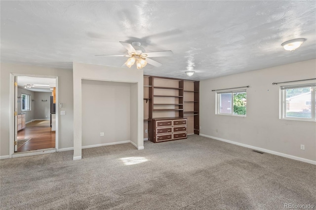 6077 Flower St, Arvada, CO 80004 - unfurnished bedroom with multiple windows and carpet