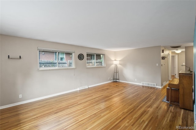 6077 Flower St, Arvada, CO 80004 - spare room with wood finished floors and baseboards