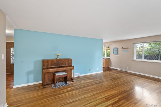 6077 Flower St, Arvada, CO 80004 - living room featuring wood finished floors and baseboards