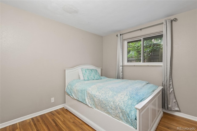 6077 Flower St, Arvada, CO 80004 - bedroom featuring wood finished floors