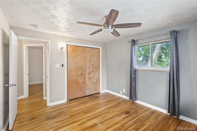 6077 Flower St, Arvada, CO 80004 - unfurnished bedroom with light wood-style flooring, a closet, and a ceiling fan