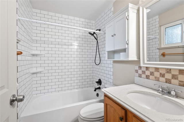 6077 Flower St, Arvada, CO 80004 - full bathroom featuring vanity, tasteful backsplash, and tub / shower combination