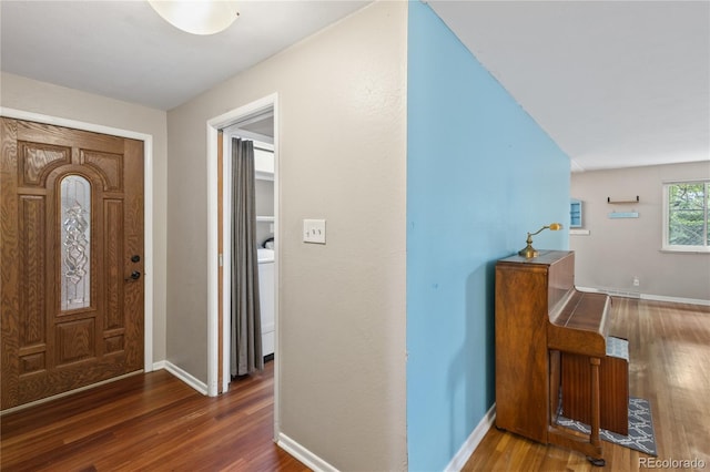 6077 Flower St, Arvada, CO 80004 - entryway with wood finished floors and washer / dryer