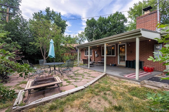 6077 Flower St, Arvada, CO 80004 - view of yard featuring a patio and an outdoor fire pit