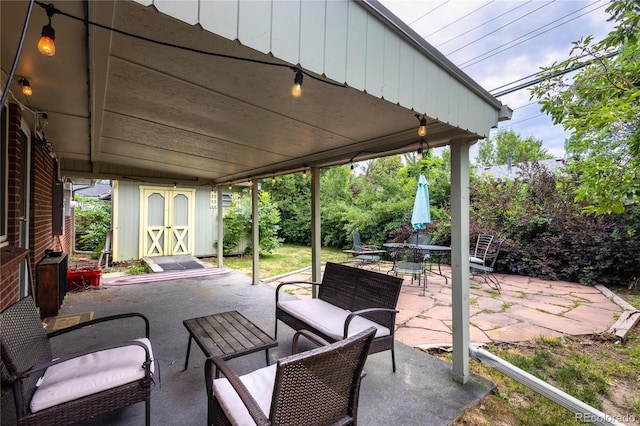 6077 Flower St, Arvada, CO 80004 - view of patio featuring a storage shed, outdoor lounge area, and outdoor dining area