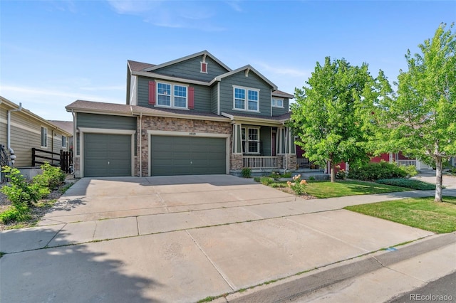14119 W 89th Loop, Arvada, CO 80005 - craftsman house with concrete driveway, a porch, and a garage