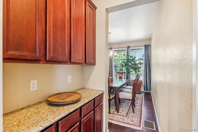 14119 W 89th Loop, Arvada, CO 80005 - kitchen with dark wood finished floors and light stone countertops