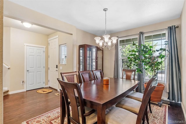 14119 W 89th Loop, Arvada, CO 80005 - dining area with a chandelier and wood finished floors