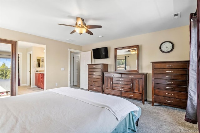14119 W 89th Loop, Arvada, CO 80005 - bedroom with light carpet and connected bathroom