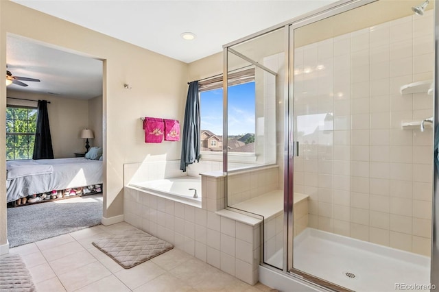 14119 W 89th Loop, Arvada, CO 80005 - ensuite bathroom featuring tile patterned floors, a garden tub, a shower stall, and a ceiling fan