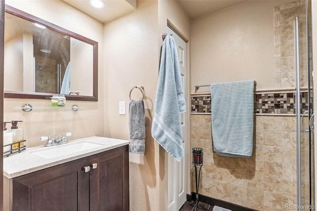 14119 W 89th Loop, Arvada, CO 80005 - bathroom featuring vanity and tiled shower