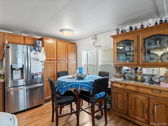 kitchen featuring stainless steel fridge and light wood-type flooring