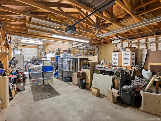 garage featuring a workshop area and a garage door opener