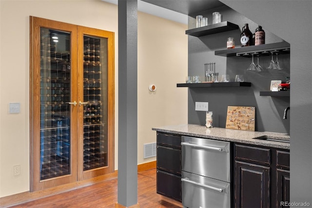 1122 Forest Trails Dr, Castle Pines, CO 80108 - wine cellar with wood finished floors and bar with sink