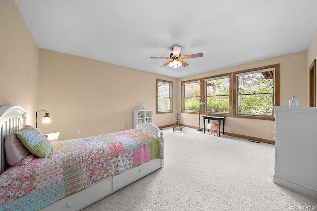 1122 Forest Trails Dr, Castle Pines, CO 80108 - carpeted bedroom with multiple windows and ceiling fan