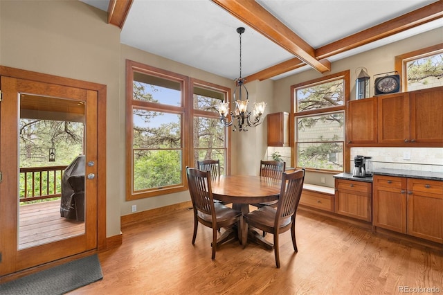 1122 Forest Trails Dr, Castle Pines, CO 80108 - dining space featuring beam ceiling, light wood finished floors, and healthy amount of natural light