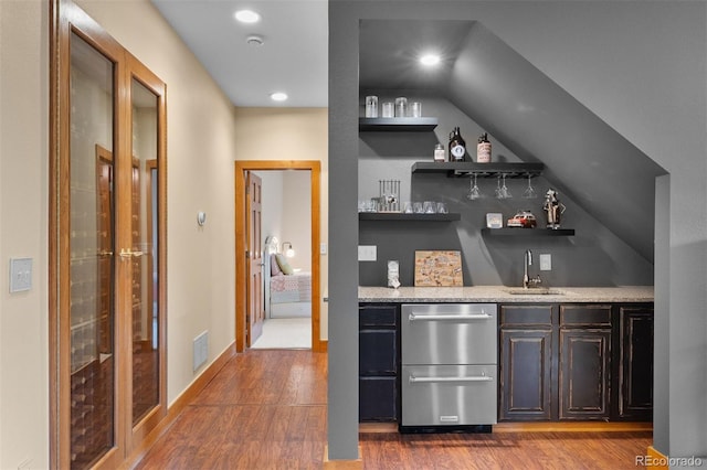 1122 Forest Trails Dr, Castle Pines, CO 80108 - indoor wet bar featuring stainless steel dishwasher, dark wood-style floors, recessed lighting, and vaulted ceiling