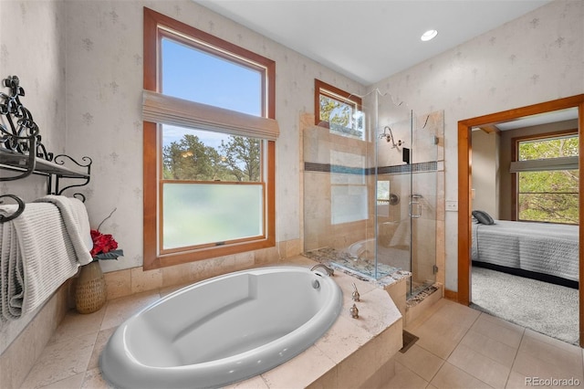 1122 Forest Trails Dr, Castle Pines, CO 80108 - full bath featuring healthy amount of natural light, a garden tub, a tile shower, connected bathroom, and wallpapered walls