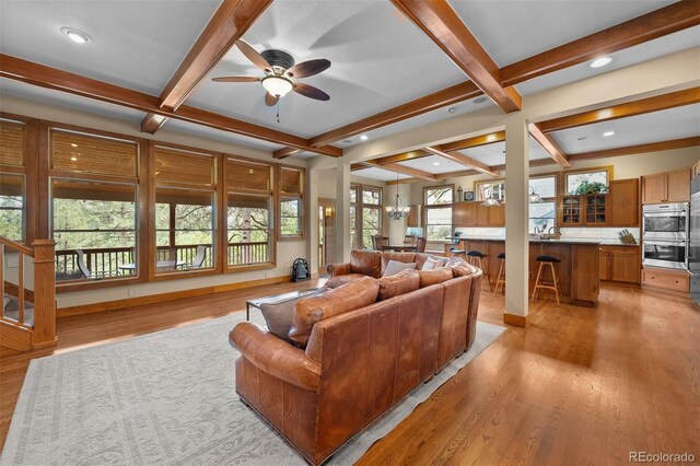 1122 Forest Trails Dr, Castle Pines, CO 80108 - living area featuring coffered ceiling, beam ceiling, a ceiling fan, light wood-type flooring, and recessed lighting