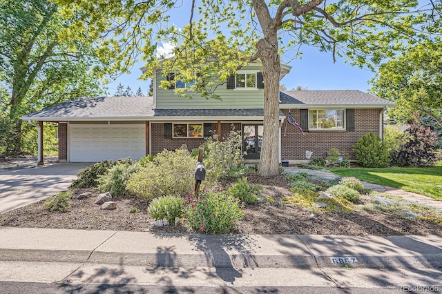 6857 S Franklin Cir, Centennial, CO 80122 - split level home featuring an attached garage, brick siding, driveway, and roof with shingles
