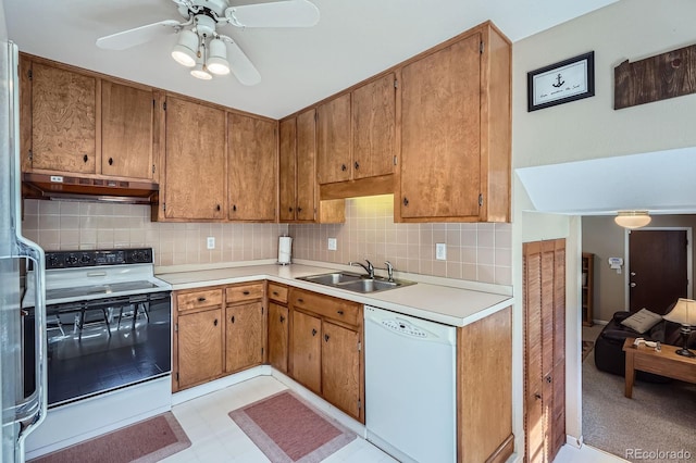6857 S Franklin Cir, Centennial, CO 80122 - kitchen featuring white dishwasher, range with electric stovetop, a sink, under cabinet range hood, and tasteful backsplash