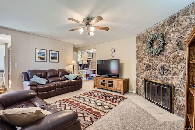 6857 S Franklin Cir, Centennial, CO 80122 - living room featuring ceiling fan, a stone fireplace, and light carpet