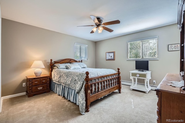 6857 S Franklin Cir, Centennial, CO 80122 - bedroom with baseboard heating, light colored carpet, baseboards, and ceiling fan