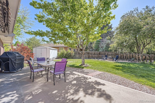 6857 S Franklin Cir, Centennial, CO 80122 - view of patio featuring a grill, outdoor dining area, and a fire pit