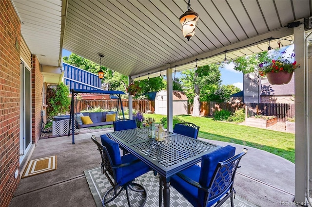 7486 S Washington St, Centennial, CO 80122 - fenced backyard with a patio area, a storage unit, outdoor lounge area, and outdoor dining area
