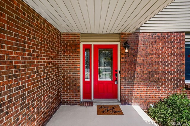 7486 S Washington St, Centennial, CO 80122 - view of exterior entry featuring brick siding