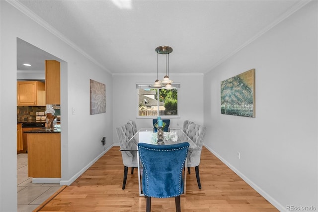 7486 S Washington St, Centennial, CO 80122 - dining space with crown molding and light wood-style floors