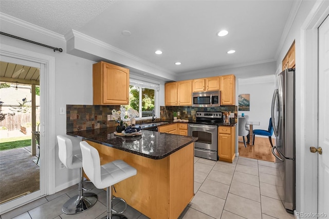 7486 S Washington St, Centennial, CO 80122 - kitchen featuring stainless steel appliances, a peninsula, light tile patterned flooring, ornamental molding, and backsplash