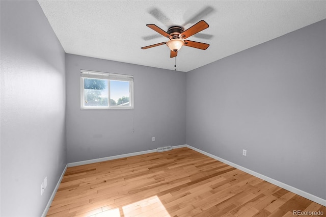 7486 S Washington St, Centennial, CO 80122 - unfurnished room with ceiling fan, light wood-style floors, and a textured ceiling