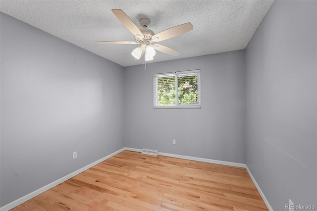 7486 S Washington St, Centennial, CO 80122 - empty room with a textured ceiling, wood finished floors, and ceiling fan