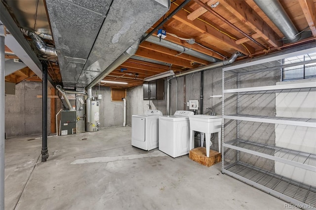 7486 S Washington St, Centennial, CO 80122 - unfinished basement featuring gas water heater, washing machine and clothes dryer, and heating unit