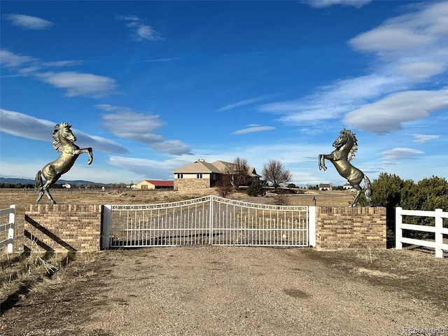 view of gate featuring fence