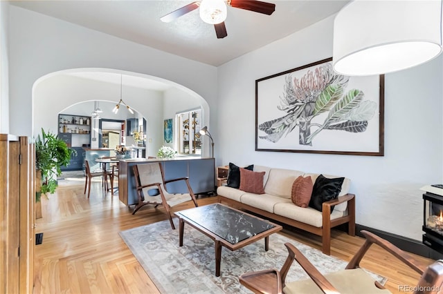 living area with ceiling fan