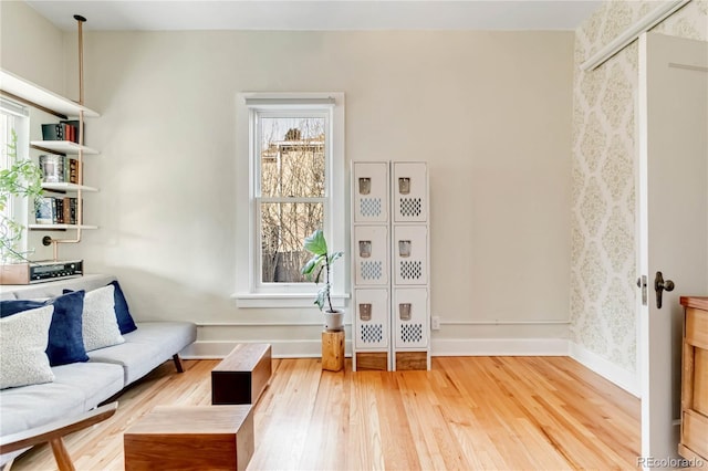 sitting room featuring baseboards and wood finished floors