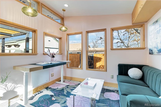 living area with recessed lighting and baseboards