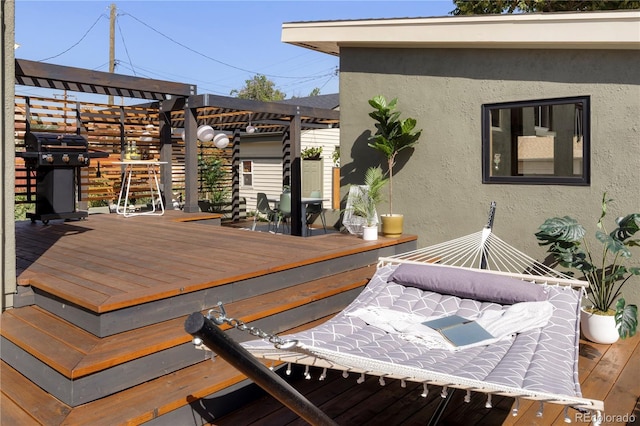 wooden terrace featuring area for grilling