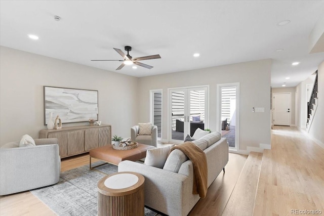 4505 S Yosemite St Unit 362, Denver, CO 80237 - living room with light wood-style flooring, ceiling fan, recessed lighting, and stairway