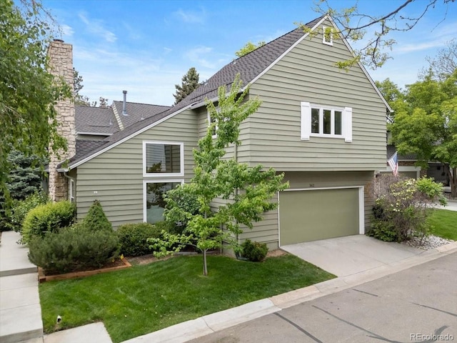 4505 S Yosemite St Unit 362, Denver, CO 80237 - view of property exterior featuring a shingled roof, a garage, a yard, and a chimney