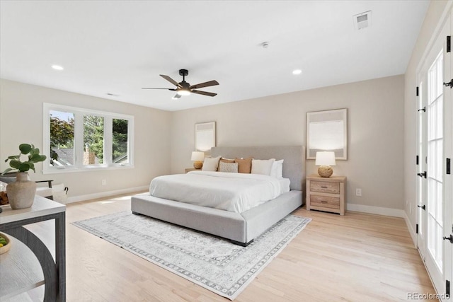 4505 S Yosemite St Unit 362, Denver, CO 80237 - bedroom with light wood-type flooring, baseboards, recessed lighting, and ceiling fan