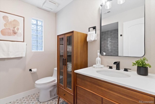 4505 S Yosemite St Unit 362, Denver, CO 80237 - bathroom with vanity, toilet, and baseboards