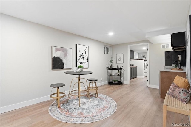 4505 S Yosemite St Unit 362, Denver, CO 80237 - dining room with light wood-style floors, baseboards, recessed lighting, and washer / dryer