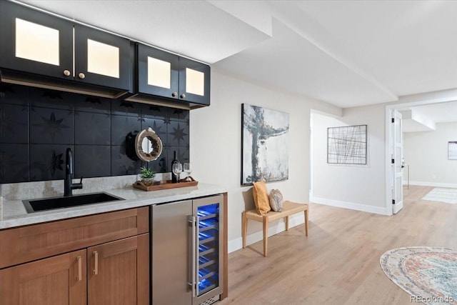 4505 S Yosemite St Unit 362, Denver, CO 80237 - indoor wet bar featuring beverage cooler, light wood finished floors, and baseboards